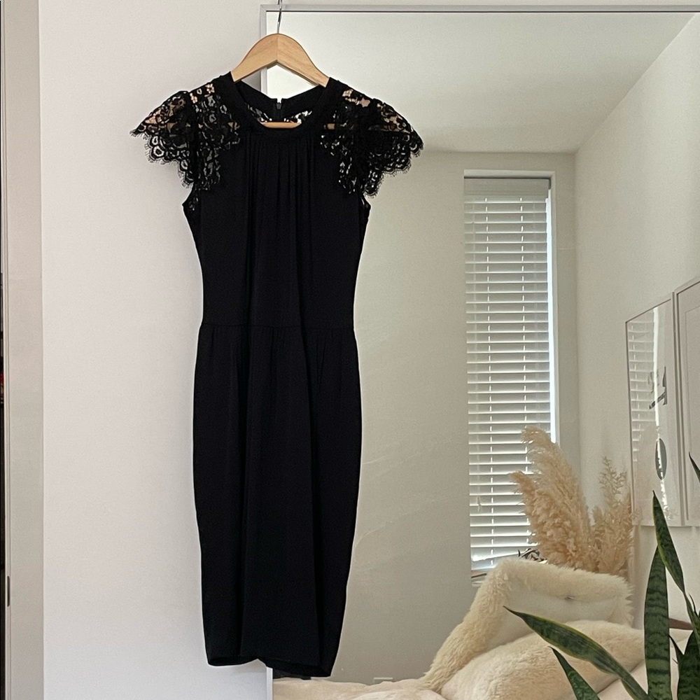 D&G black cocktail dress with lace shoulder detail. Classic LBD.